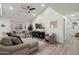 A spacious living room boasts a comfortable sectional sofa, bay window, and media console for a cozy feel at 6725 E Kings Ave, Scottsdale, AZ 85254