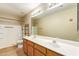 Bathroom with double sink vanity and a walk-in shower with toiletry shelving at 7019 S 19Th Pl, Phoenix, AZ 85042