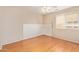 Bedroom with wood-look flooring, and bright window at 7019 S 19Th Pl, Phoenix, AZ 85042