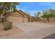 Charming single-story home featuring a three car garage and low-maintenance desert landscaping at 7019 S 19Th Pl, Phoenix, AZ 85042