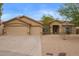 Charming single-story home featuring a three car garage and low-maintenance desert landscaping at 7019 S 19Th Pl, Phoenix, AZ 85042