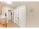 View of hallway with tile floors, closet, fire extinguisher, and multiple doorways at 7019 S 19Th Pl, Phoenix, AZ 85042
