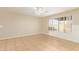 Spacious living room featuring neutral walls, tile flooring, and a ceiling fan, offering a bright and airy ambiance at 7019 S 19Th Pl, Phoenix, AZ 85042