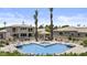 Community pool with lounge chairs and well-manicured lawns offers a relaxing getaway at 7262 E Lupine Ave, Scottsdale, AZ 85260