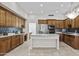 Spacious kitchen with a large center island, stainless steel appliances, and custom wood cabinetry at 7262 E Lupine Ave, Scottsdale, AZ 85260