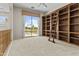 Cozy office space with built-in bookshelves, a library ladder, and neighborhood views at 7262 E Lupine Ave, Scottsdale, AZ 85260