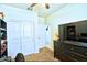 Cozy bedroom featuring a large window, ample closet space, and neutral paint at 7751 W Miami St, Phoenix, AZ 85043