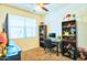 Comfortable bedroom with plush carpet, bright natural light, and ample space for a desk and shelving at 7751 W Miami St, Phoenix, AZ 85043