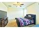 A comfortable bedroom with a stylish bed, soft carpeting, and a TV for entertainment at 7751 W Miami St, Phoenix, AZ 85043