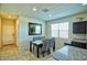 Bright dining area featuring tile floors, a window, and a modern table set for four at 7751 W Miami St, Phoenix, AZ 85043