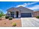 Beautiful single-story home with desert landscaping, covered porch, and neutral color scheme at 7751 W Miami St, Phoenix, AZ 85043