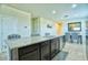 Open kitchen design with granite countertops, stainless steel appliances and tile floors at 7751 W Miami St, Phoenix, AZ 85043