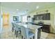 Spacious kitchen with granite island, stainless steel appliances, and stylish seating at 7751 W Miami St, Phoenix, AZ 85043