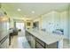Large kitchen island with breakfast bar, stainless appliances, and comfortable living area at 7751 W Miami St, Phoenix, AZ 85043