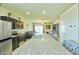 Bright kitchen area with stainless steel appliances, granite island, and an open floor plan at 7751 W Miami St, Phoenix, AZ 85043
