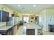 Spacious kitchen with stainless appliances, granite countertops, and an open-concept layout at 7751 W Miami St, Phoenix, AZ 85043