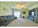 Bright living room with a comfortable sectional sofa and access to a patio through a sliding glass door at 7751 W Miami St, Phoenix, AZ 85043