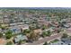 Enjoy this aerial view of the neighborhood with mature trees and close proximity to shops and schools at 8140 E Mitchell Dr, Scottsdale, AZ 85251