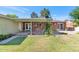 This home features a charming brick exterior and a well-maintained backyard with a covered patio at 8140 E Mitchell Dr, Scottsdale, AZ 85251