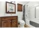 Well-lit bathroom featuring a vanity with sink, a toilet, and a shower-tub combination at 8140 E Mitchell Dr, Scottsdale, AZ 85251