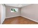 Bright bedroom with tile floors, a window overlooking the yard, and a closet with sliding doors at 8140 E Mitchell Dr, Scottsdale, AZ 85251