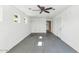 Bright garage with white walls, a ceiling fan, and an entry door leading to the house at 8140 E Mitchell Dr, Scottsdale, AZ 85251