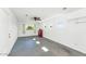 Spacious garage with a ceiling fan, windows for natural light, and ample room for storage at 8140 E Mitchell Dr, Scottsdale, AZ 85251