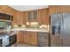 Close up shot of the stainless steel appliances and the beautiful cabinetry in the kitchen at 8140 E Mitchell Dr, Scottsdale, AZ 85251