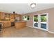 Spacious kitchen and dining area featuring stainless steel appliances and beautiful cabinets at 8140 E Mitchell Dr, Scottsdale, AZ 85251