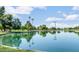 Reflective lake surrounded by lush greenery, providing a serene and natural setting at 8140 E Mitchell Dr, Scottsdale, AZ 85251