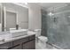 Stylish bathroom featuring a vessel sink on a marble countertop and a sleek, glass-enclosed shower at 9231 W Grovers Ave, Peoria, AZ 85382