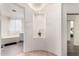 Elegant bathroom featuring a soaking tub, decorative niche, and modern finishes at 9622 S 46Th Ln, Laveen, AZ 85339