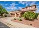 Beautiful home with a three car garage, well-manicured lawn and attractive desert landscaping at 9622 S 46Th Ln, Laveen, AZ 85339