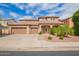 Beautiful home with a three car garage, well-manicured lawn and attractive desert landscaping at 9622 S 46Th Ln, Laveen, AZ 85339