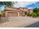 Beautiful home with a three car garage, well-manicured lawn and attractive desert landscaping at 9622 S 46Th Ln, Laveen, AZ 85339