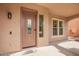 Charming front porch and entry door with decorative glass and sidelight windows at 9622 S 46Th Ln, Laveen, AZ 85339