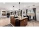 Spacious kitchen island with granite countertops and stainless steel appliances is open to living spaces at 9622 S 46Th Ln, Laveen, AZ 85339