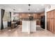 Well-lit kitchen features a large island, pendant lighting, and stainless steel appliances at 9622 S 46Th Ln, Laveen, AZ 85339