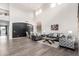 Spacious living room features soaring ceilings, large windows, and stylish contemporary decor at 9622 S 46Th Ln, Laveen, AZ 85339