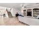 Inviting living room featuring a staircase, a built-in entertainment center, and stylish furniture at 9622 S 46Th Ln, Laveen, AZ 85339