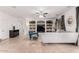 Inviting living room featuring a staircase, a built-in entertainment center, and stylish furniture at 9622 S 46Th Ln, Laveen, AZ 85339