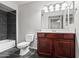 Bathroom with marble tile shower and dark wood vanity at 9990 N Scottsdale Rd # 2029, Paradise Valley, AZ 85253