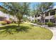 Well-maintained green courtyard with lush landscaping, grassy areas, and blooming flowers at 9990 N Scottsdale Rd # 2029, Paradise Valley, AZ 85253