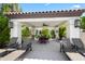 Outdoor patio with shaded seating area and lounge chairs at 9990 N Scottsdale Rd # 2029, Paradise Valley, AZ 85253