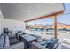 Covered patio with comfortable seating, overlooking the pool and colorful wall mural at 1003 E Marigold Ln, Tempe, AZ 85288