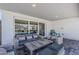 Inviting outdoor living area with cushioned seating and views of the backyard pool at 1003 E Marigold Ln, Tempe, AZ 85288