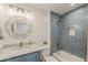 Stylish bathroom with shiplap, a decorative mirror, and a tub/shower combo at 1003 E Marigold Ln, Tempe, AZ 85288