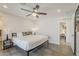 Sun-filled bedroom with ceiling fan and a modern bed frame, enhancing the room's charm at 1003 E Marigold Ln, Tempe, AZ 85288