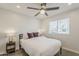 Bright bedroom featuring a ceiling fan, neutral walls, and natural light from a window at 1003 E Marigold Ln, Tempe, AZ 85288