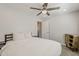 Cozy bedroom featuring a ceiling fan, neutral walls, and door to a closet at 1003 E Marigold Ln, Tempe, AZ 85288